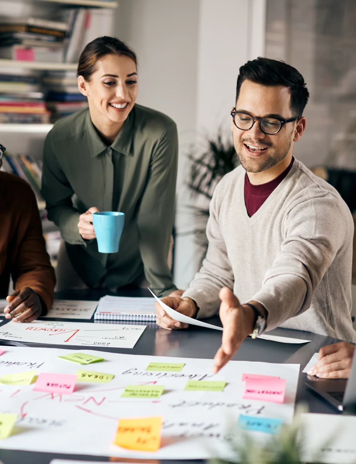Agency colleagues discussing content plans around a table